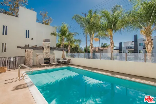 a view of a yard with cars