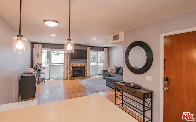 a kitchen with a sink cabinets and stainless steel appliances