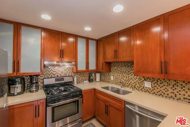 a view of a kitchen counter space and wooden floor