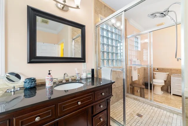 a bathroom with a sink double vanity and a mirror