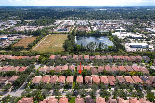 an aerial view of residential building and lake