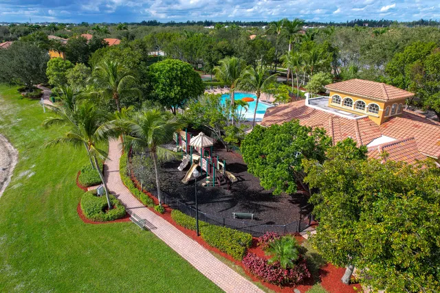 a view of a backyard with plants and outdoor seating