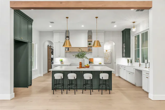 a kitchen with a sink a cabinets and window