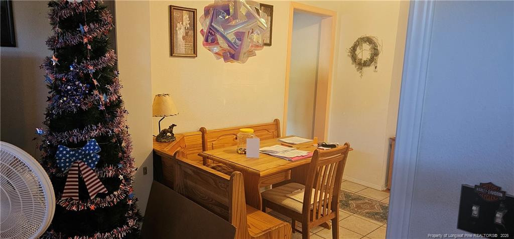 212 McIver Road Lumber Bridge, NC 28357 - Photo 15 of 28 a room with a table and chairs