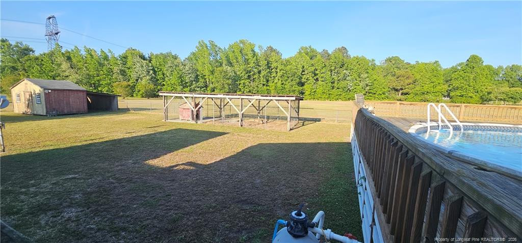 212 McIver Road Lumber Bridge, NC 28357 - Photo 5 of 28 a view of a swimming pool with a patio
