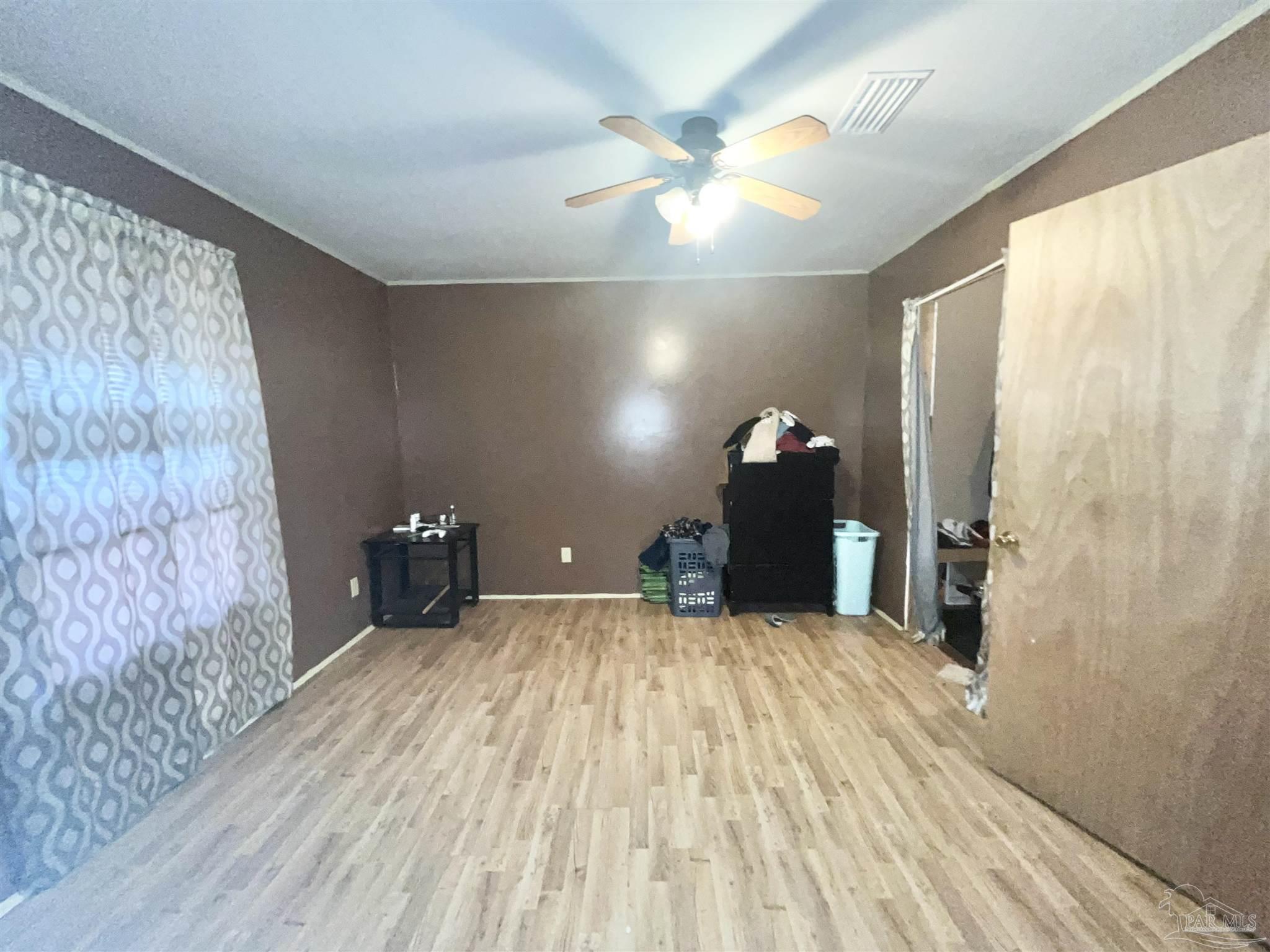 1482 Smith Dairy Road Atmore, AL 36502 - Photo 13 of 34 a view of a room with a flat screen tv