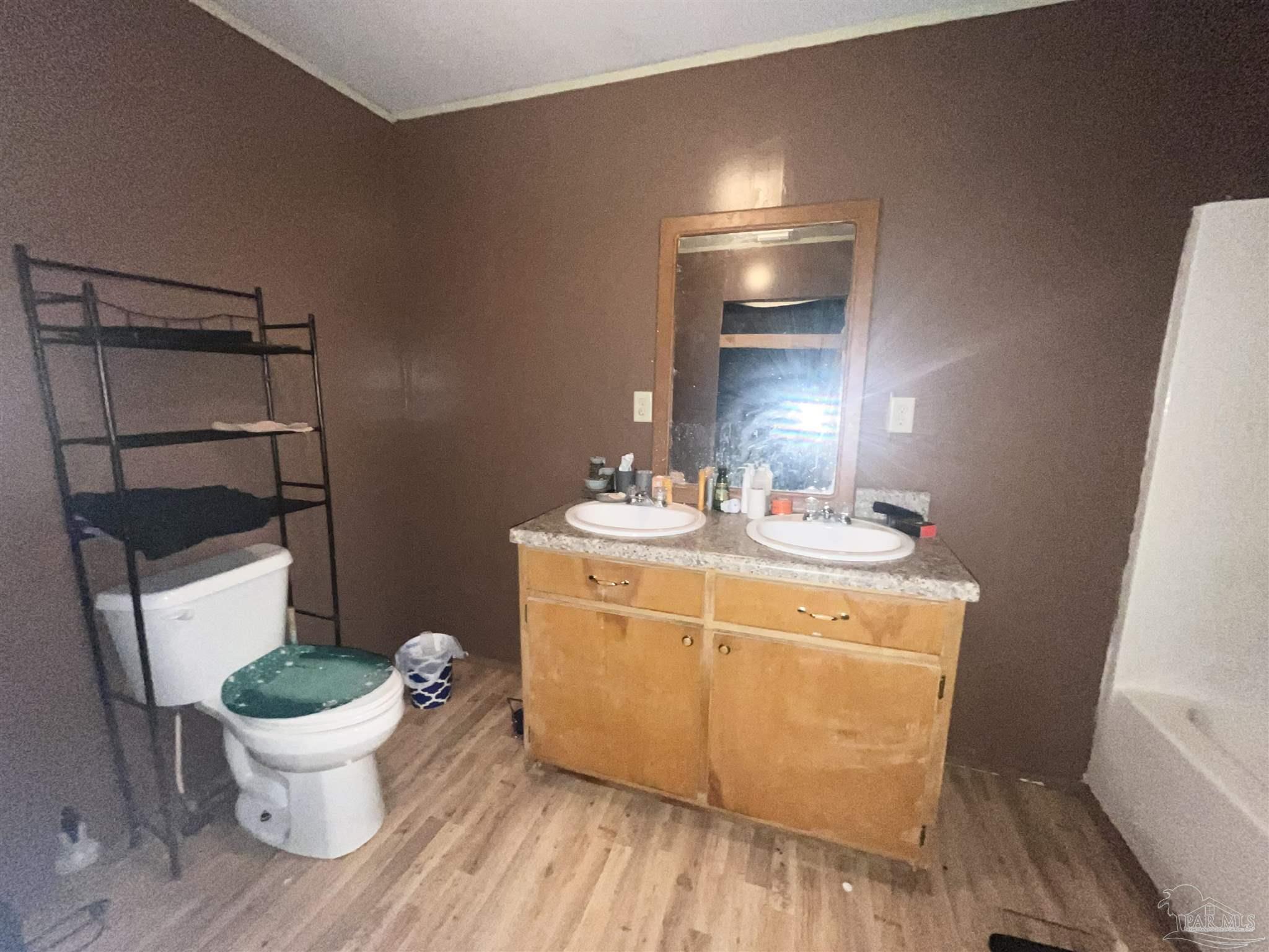 1482 Smith Dairy Road Atmore, AL 36502 - Photo 15 of 34 a bathroom with a sink and a mirror