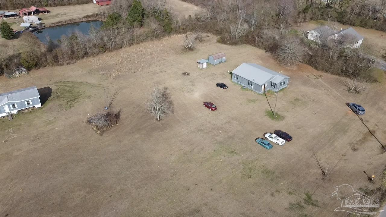 1482 Smith Dairy Road Atmore, AL 36502 - Photo 17 of 34 an aerial view of a highlighted house with outdoor space