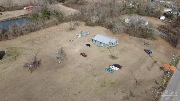 an aerial view of house with yard