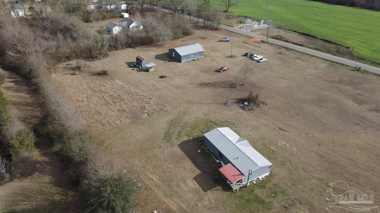 1482 Smith Dairy Road Atmore, AL 36502 - Photo 19 of 34 an aerial view of a house with a yard