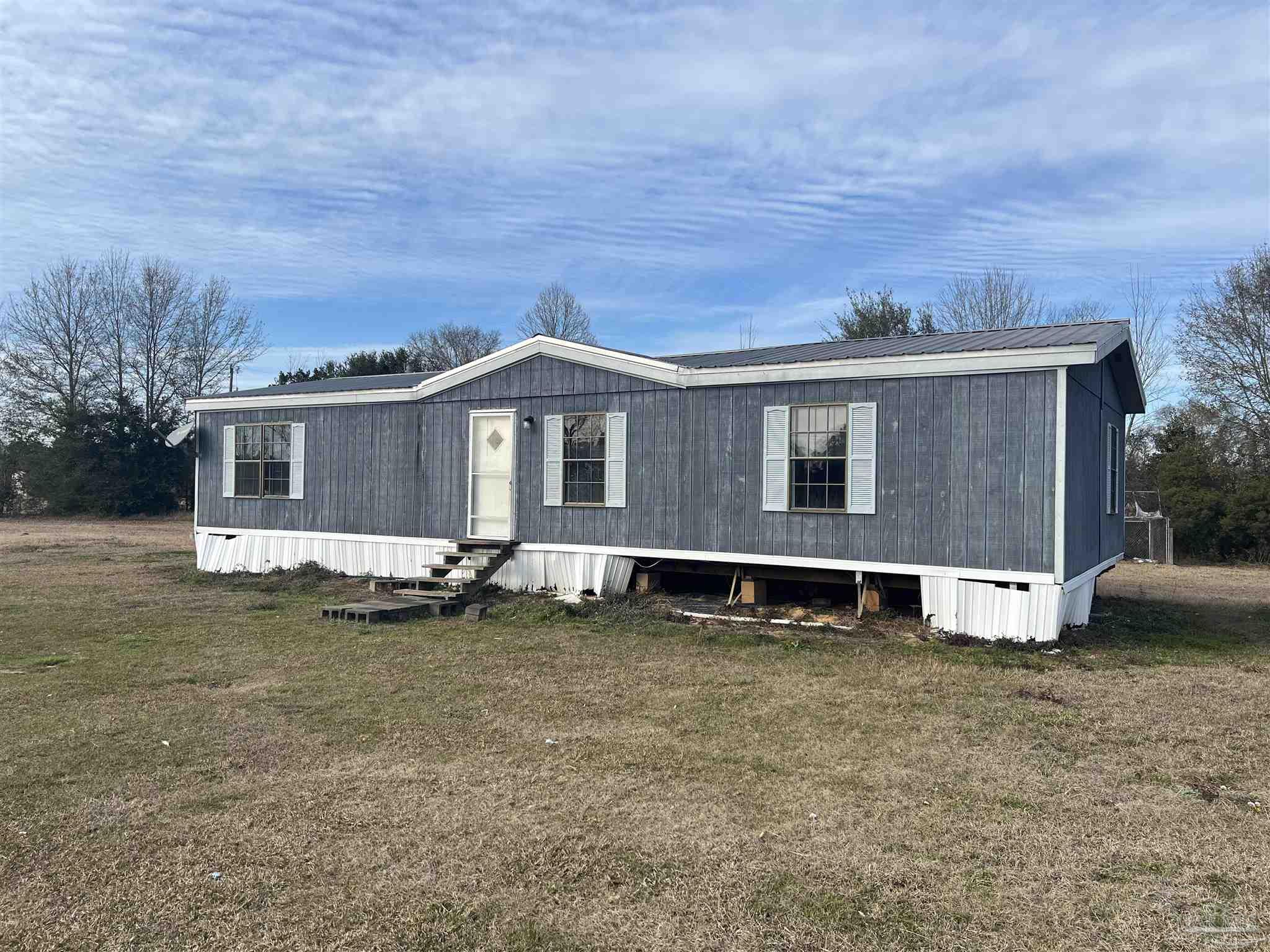 1482 Smith Dairy Road Atmore, AL 36502 - Photo 2 of 34 a view of a house with a yard and sitting area