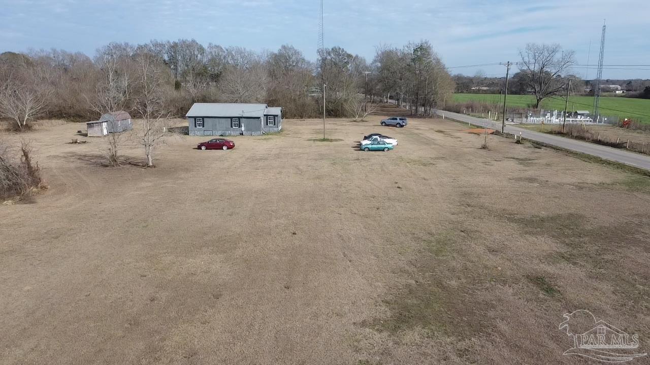 1482 Smith Dairy Road Atmore, AL 36502 - Photo 29 of 34 a view of a town with couple of cars parked