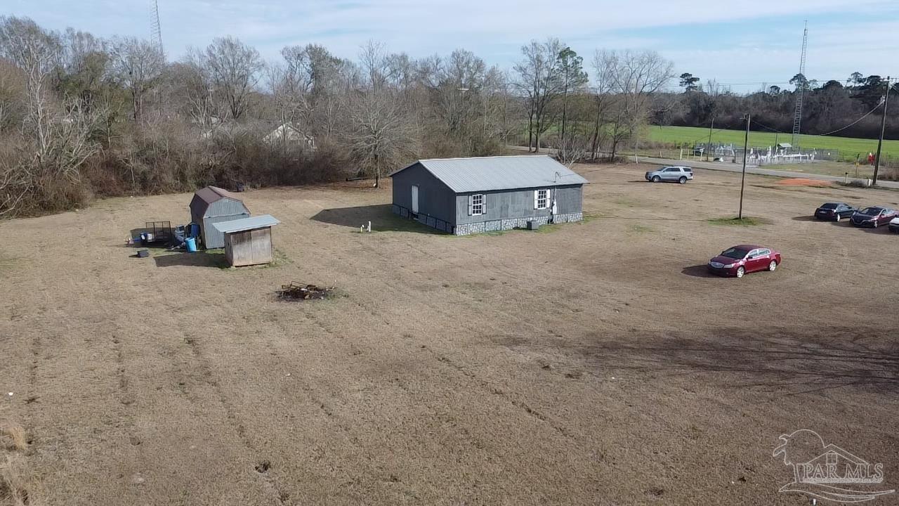 1482 Smith Dairy Road Atmore, AL 36502 - Photo 31 of 34 a view of a terrace with a bench