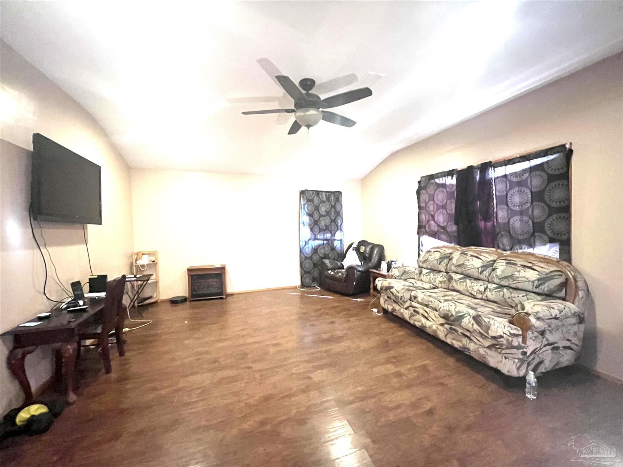 1482 Smith Dairy Road Atmore, AL 36502 - Photo 5 of 34 a living room with furniture and a flat screen tv