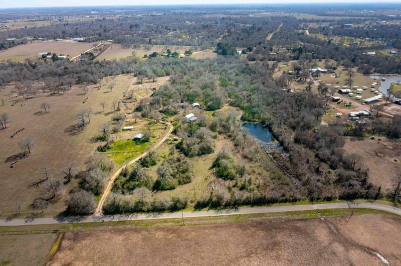 38241 Wiggins Road Hempstead, TX 77445 - Photo 17 of 48 an aerial view of a house with a yard