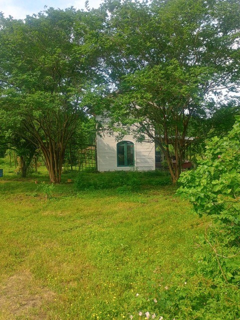 38241 Wiggins Road Hempstead, TX 77445 - Photo 47 of 48 a house view with a garden space