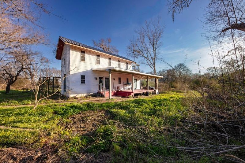 38241 Wiggins Road Hempstead, TX 77445 - Photo 8 of 48 a view of a house with a yard
