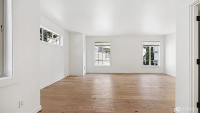 a view of an empty room with windows