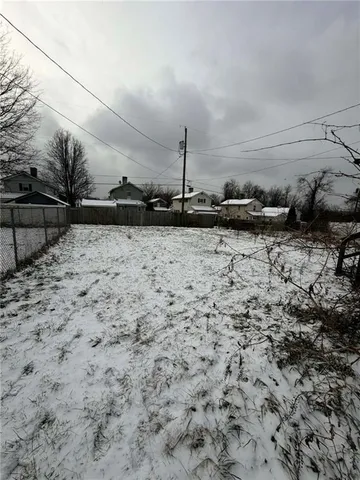 a view of a backyard of the house