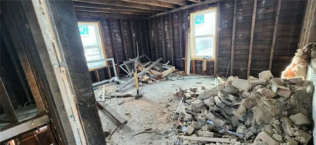 a view of living room with furniture and window