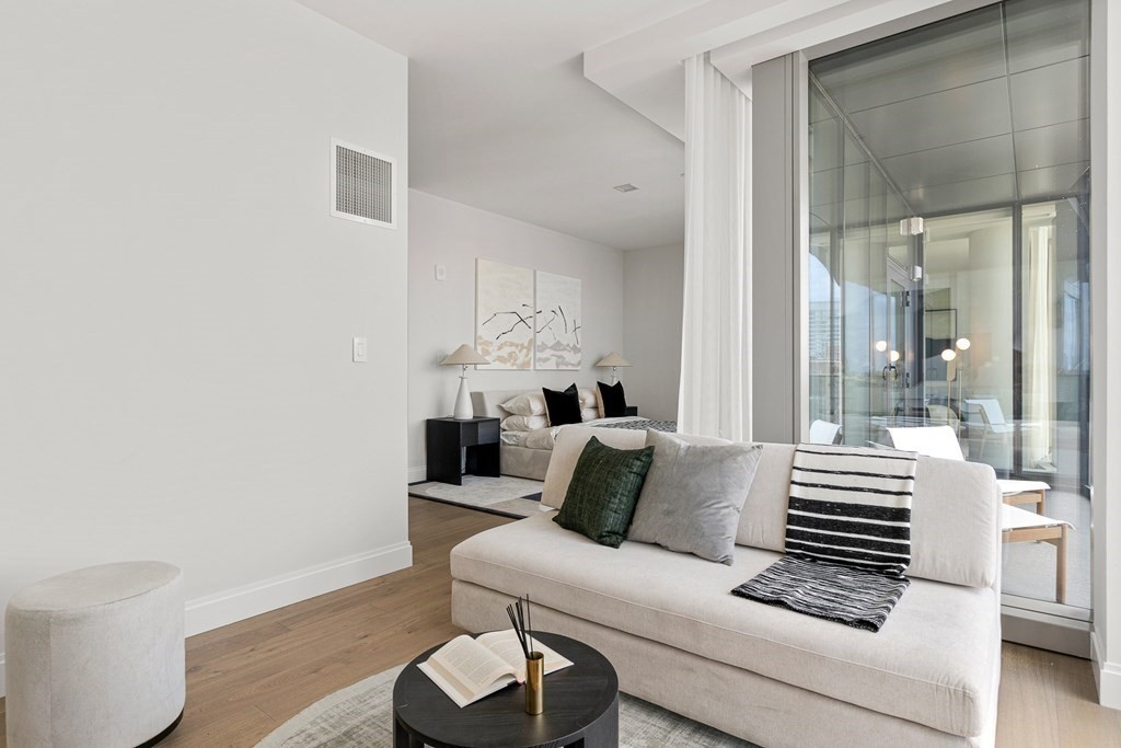 100 Shawmut Avenue, Unit PH A Boston, MA 02118 - Photo 11 of 39 a living room with furniture and a potted plant
