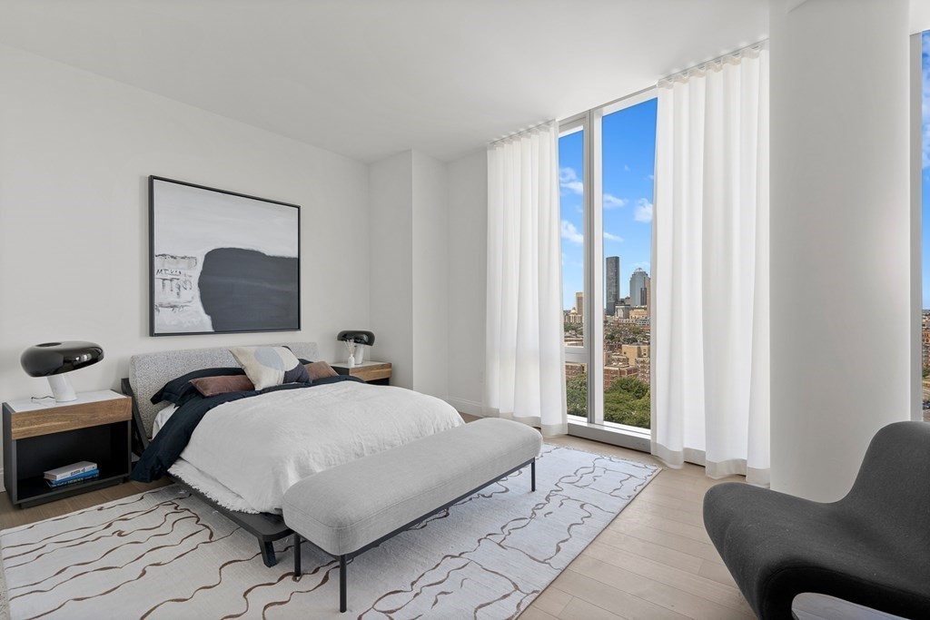 100 Shawmut Avenue, Unit PH A Boston, MA 02118 - Photo 12 of 39 a bedroom with a bed and large window