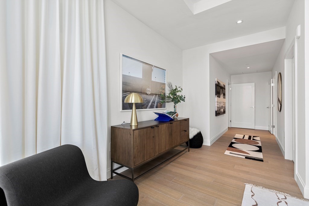 100 Shawmut Avenue, Unit PH A Boston, MA 02118 - Photo 13 of 39 a living room with furniture and a wooden floor