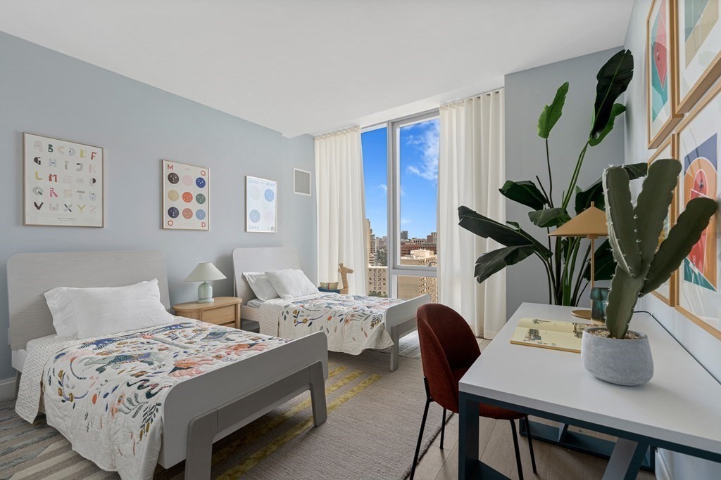 100 Shawmut Avenue, Unit PH A Boston, MA 02118 - Photo 14 of 39 a bedroom with furniture and a potted plant