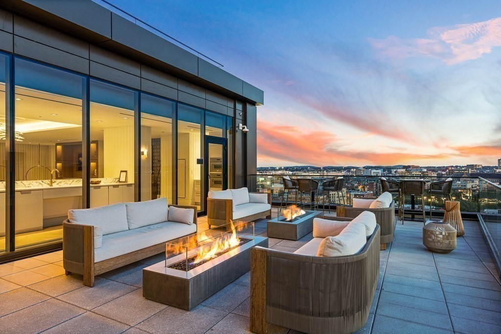 100 Shawmut Avenue, Unit PH A Boston, MA 02118 - Photo 22 of 39 a outdoor living space with patio furniture and a view of living room