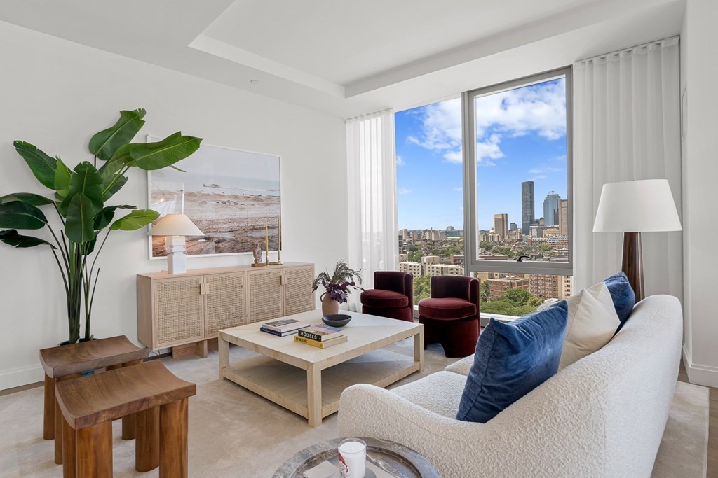 100 Shawmut Avenue, Unit PH A Boston, MA 02118 - Photo 6 of 39 a living room with furniture and a large window