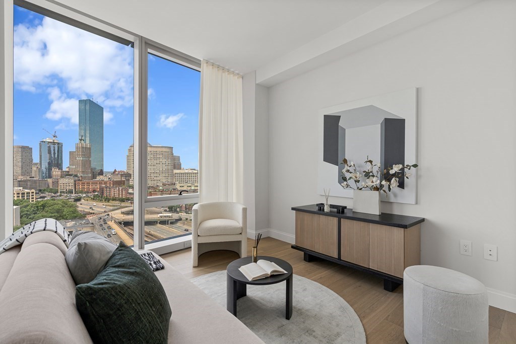 100 Shawmut Avenue, Unit PH A Boston, MA 02118 - Photo 9 of 39 a living room with furniture a rug and a large mirror