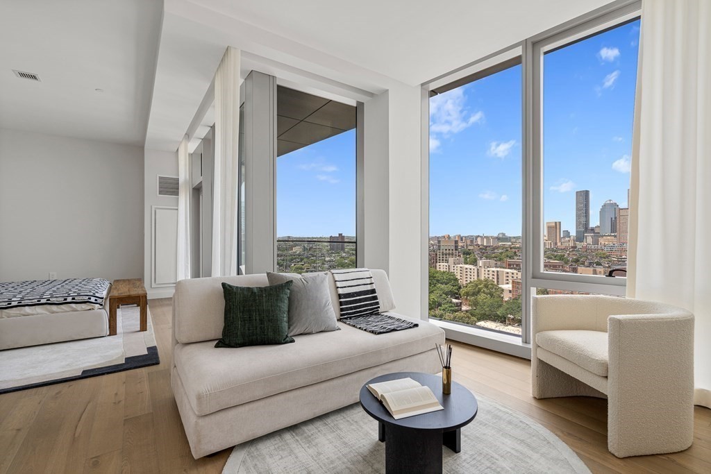 100 Shawmut Avenue, Unit PH A Boston, MA 02118 - Photo 10 of 39 a living room with furniture and a large window