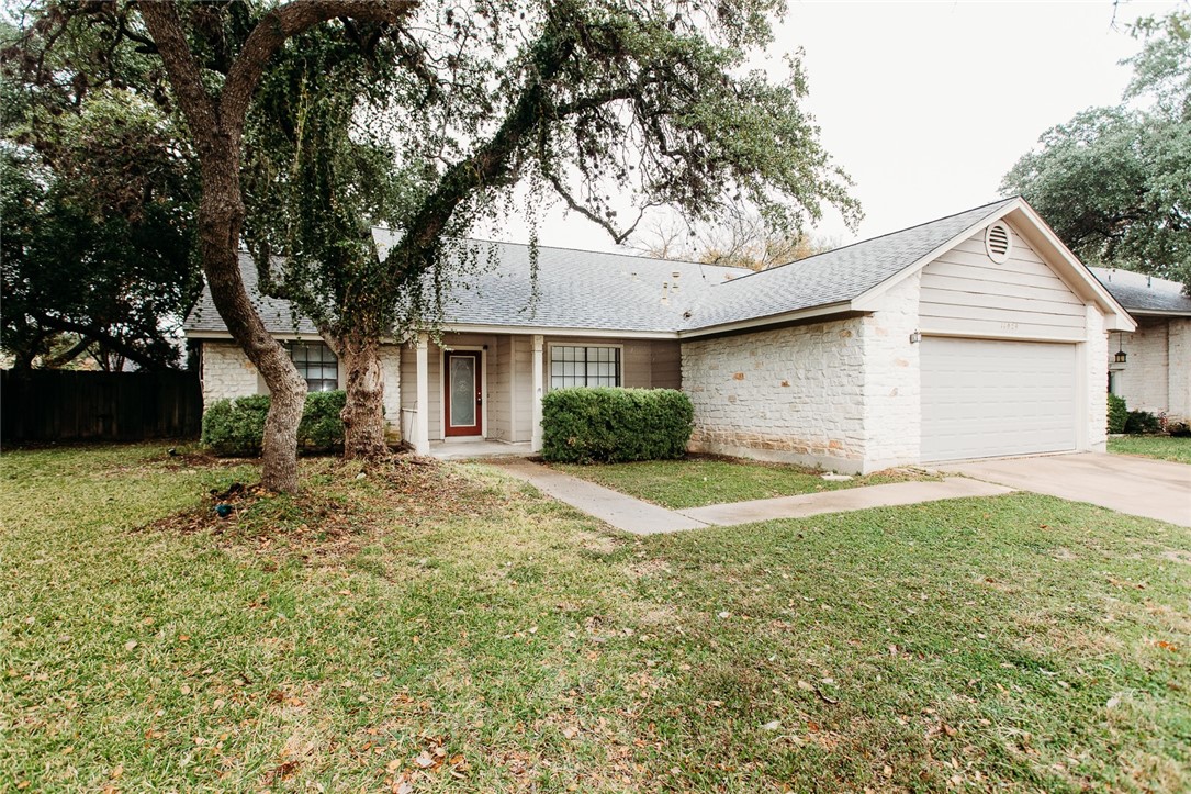 11929 Bittern Hollow Austin, TX 78758 - Photo 1 of 1 a view of a yard in front of a house with large trees
