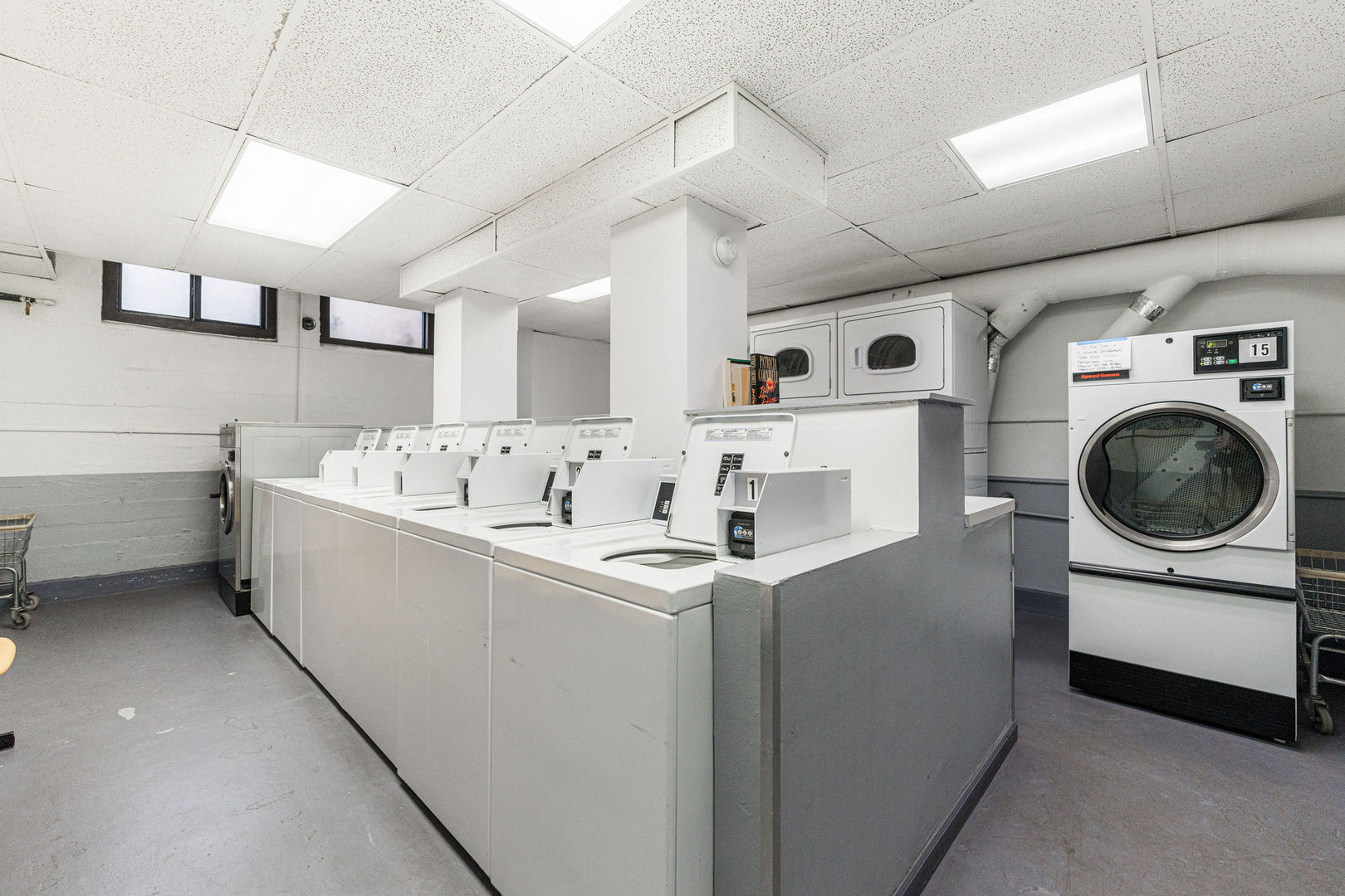 6101 North Sheridan Road, Unit 8G Chicago, IL 60660 - Photo 14 of 15 a utility room with cabinets dryer and washer