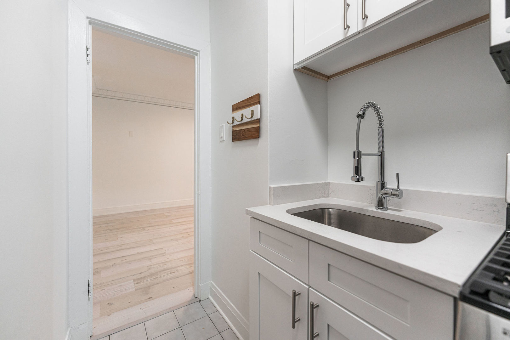 6101 North Sheridan Road, Unit 8G Chicago, IL 60660 - Photo 6 of 15 a kitchen with a sink and cabinets
