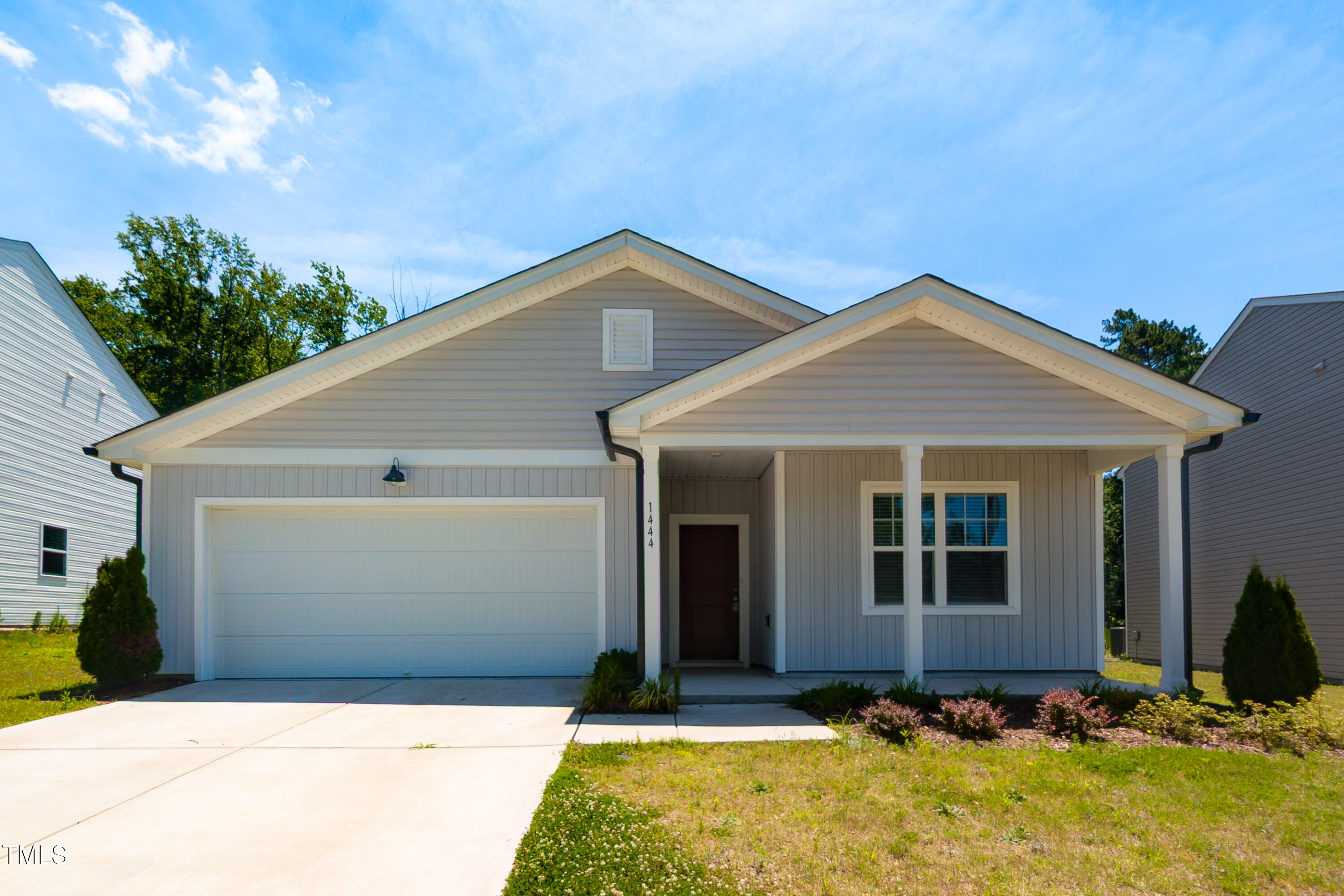 1444 Heron Pond Street Raleigh, NC 27604 - Photo 1 of 37 a front view of a house with a yard