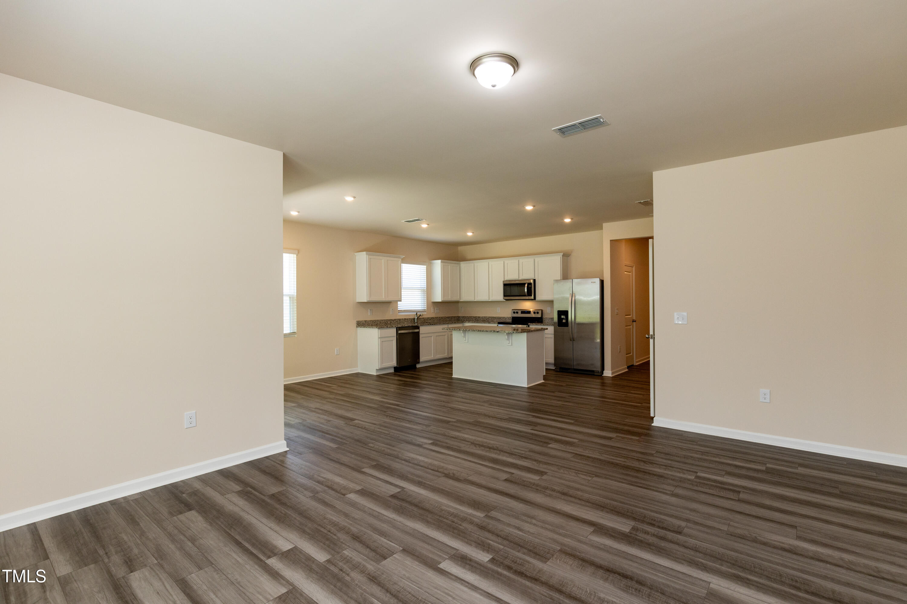 1444 Heron Pond Street Raleigh, NC 27604 - Photo 12 of 37 a view of kitchen with kitchen island wooden floor and center island