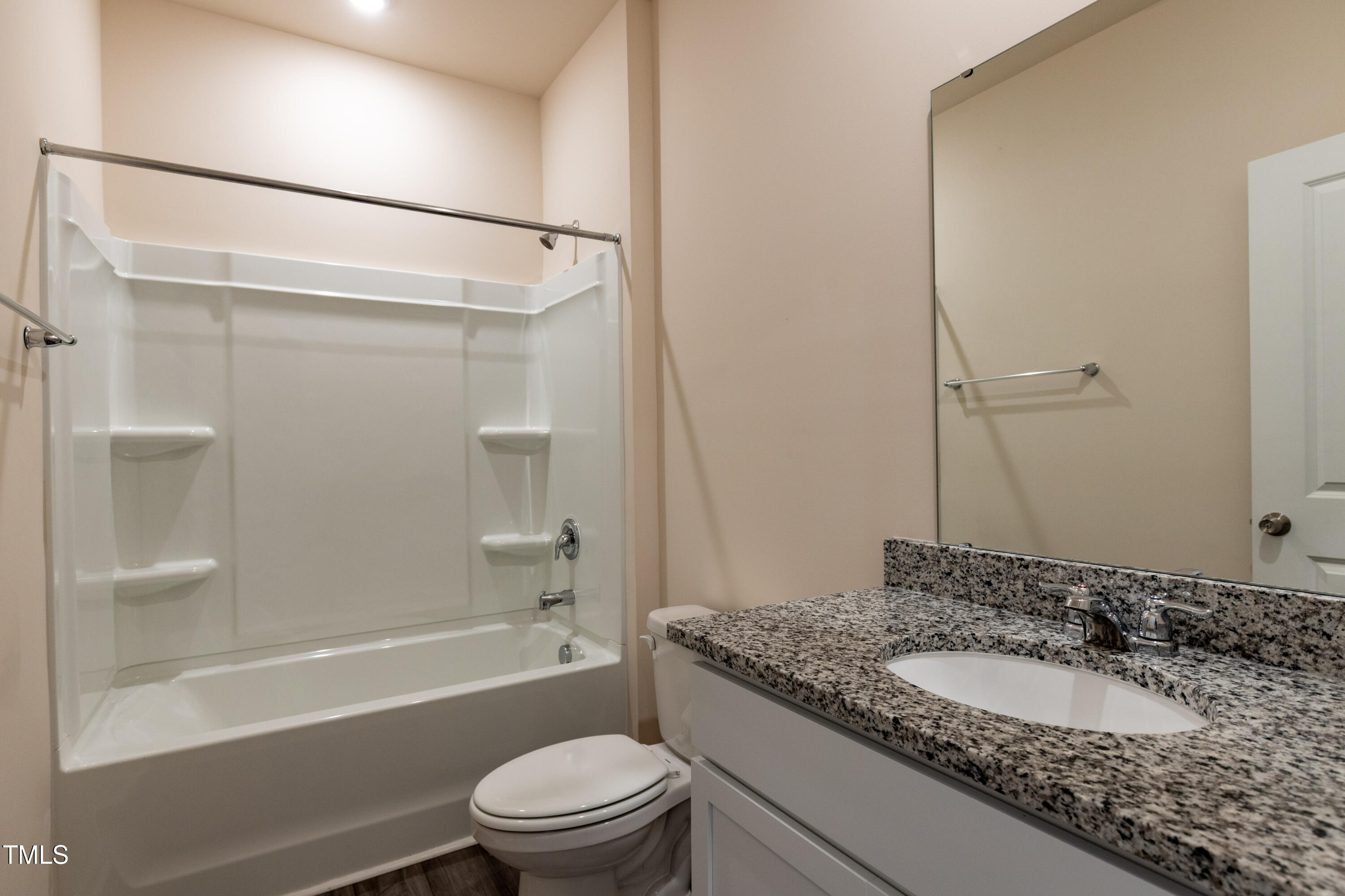 1444 Heron Pond Street Raleigh, NC 27604 - Photo 16 of 37 a bathroom with a granite countertop sink toilet and shower