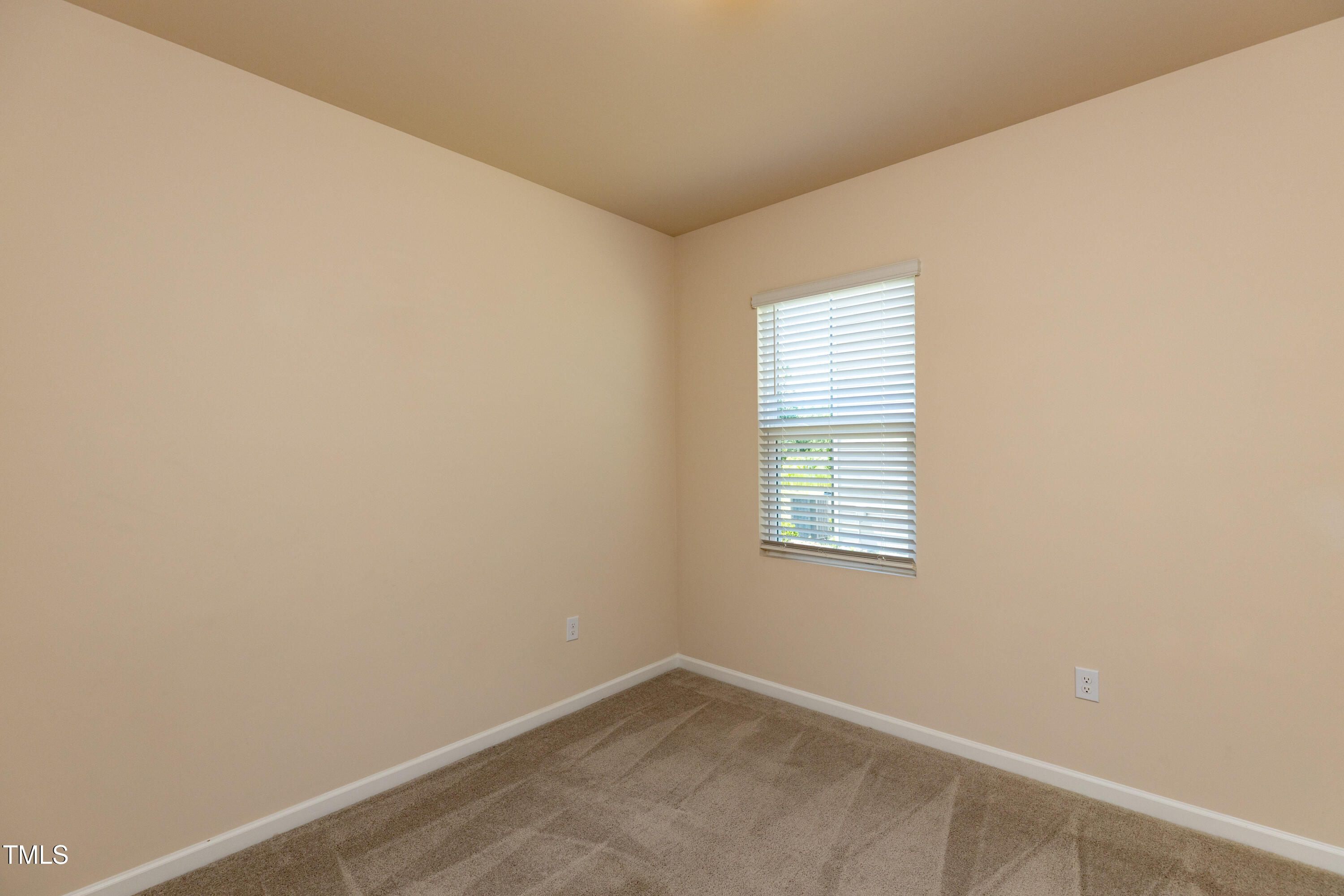 1444 Heron Pond Street Raleigh, NC 27604 - Photo 17 of 37 an empty room with a window