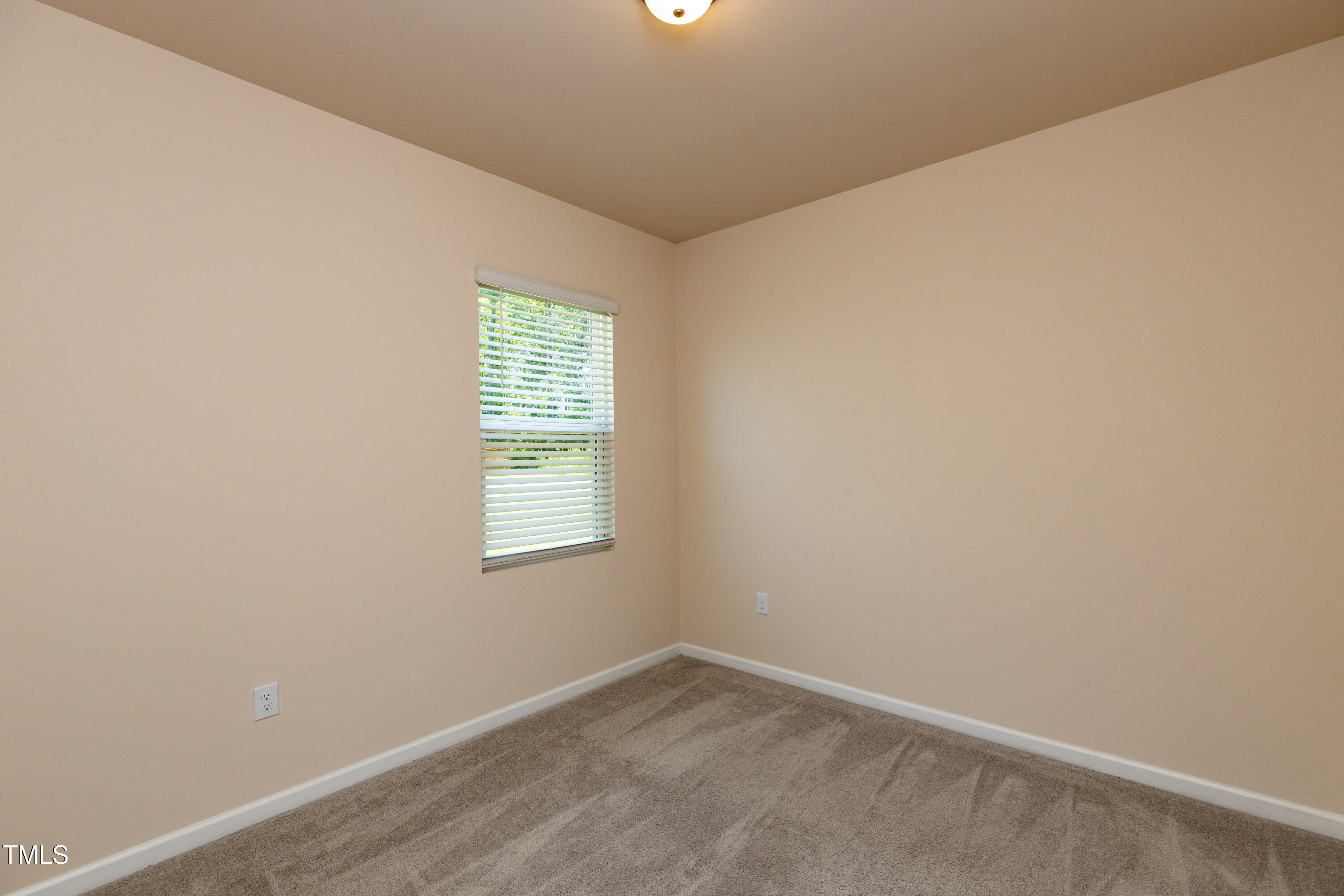 1444 Heron Pond Street Raleigh, NC 27604 - Photo 19 of 37 an empty room with a window