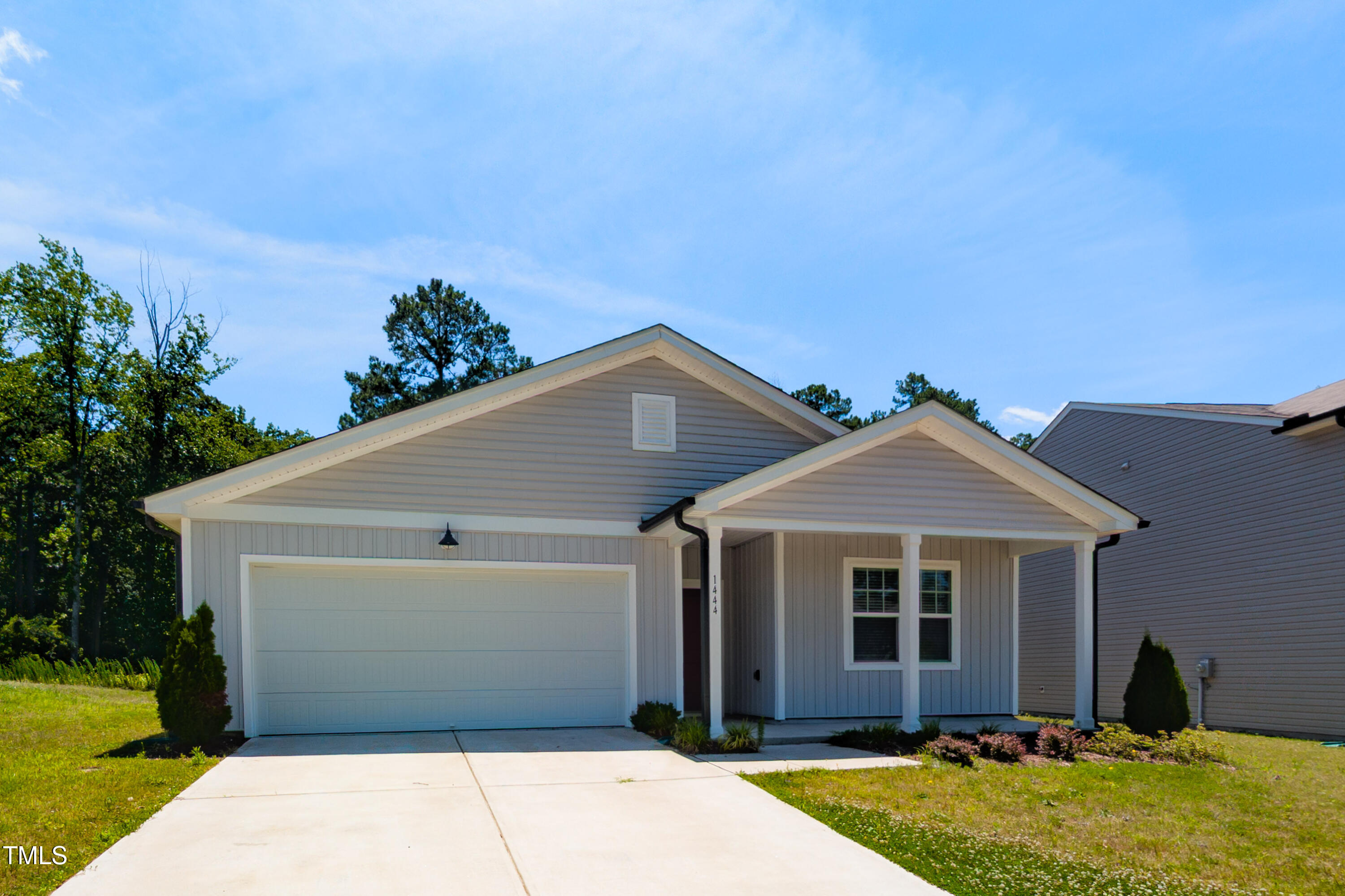 1444 Heron Pond Street Raleigh, NC 27604 - Photo 2 of 37 a front view of a house with a yard