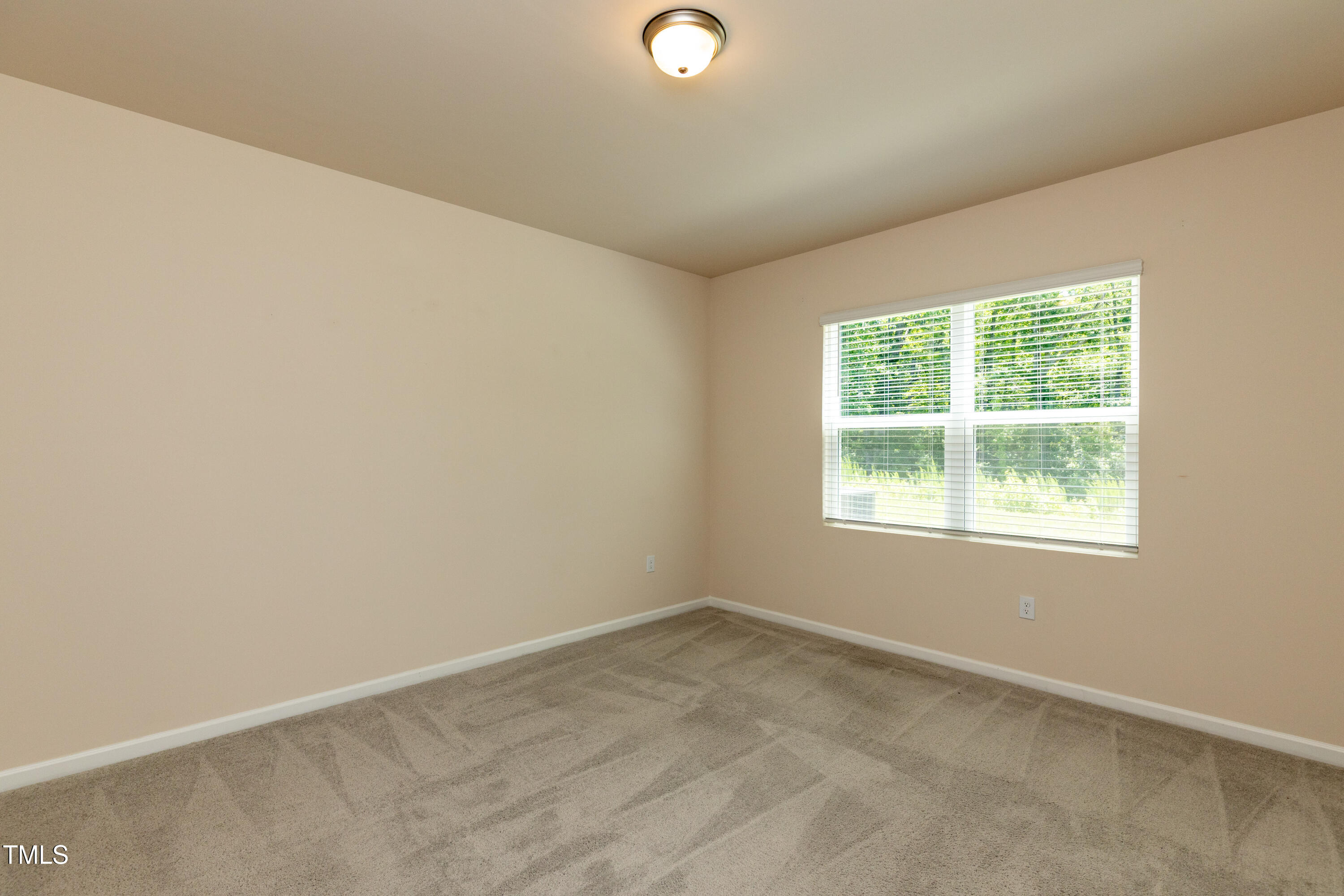 1444 Heron Pond Street Raleigh, NC 27604 - Photo 21 of 37 an empty room with a window