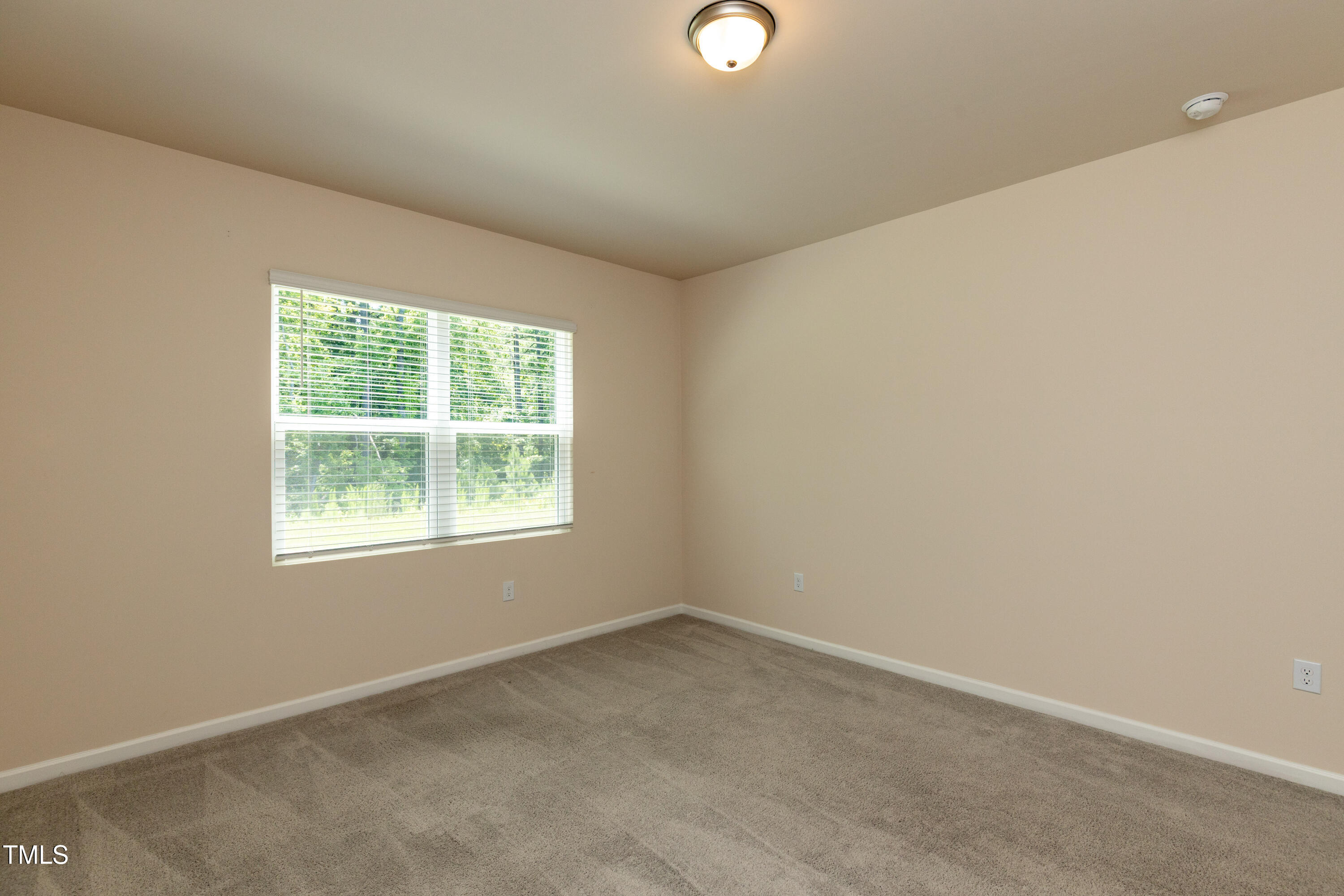 1444 Heron Pond Street Raleigh, NC 27604 - Photo 23 of 37 an empty room with a window