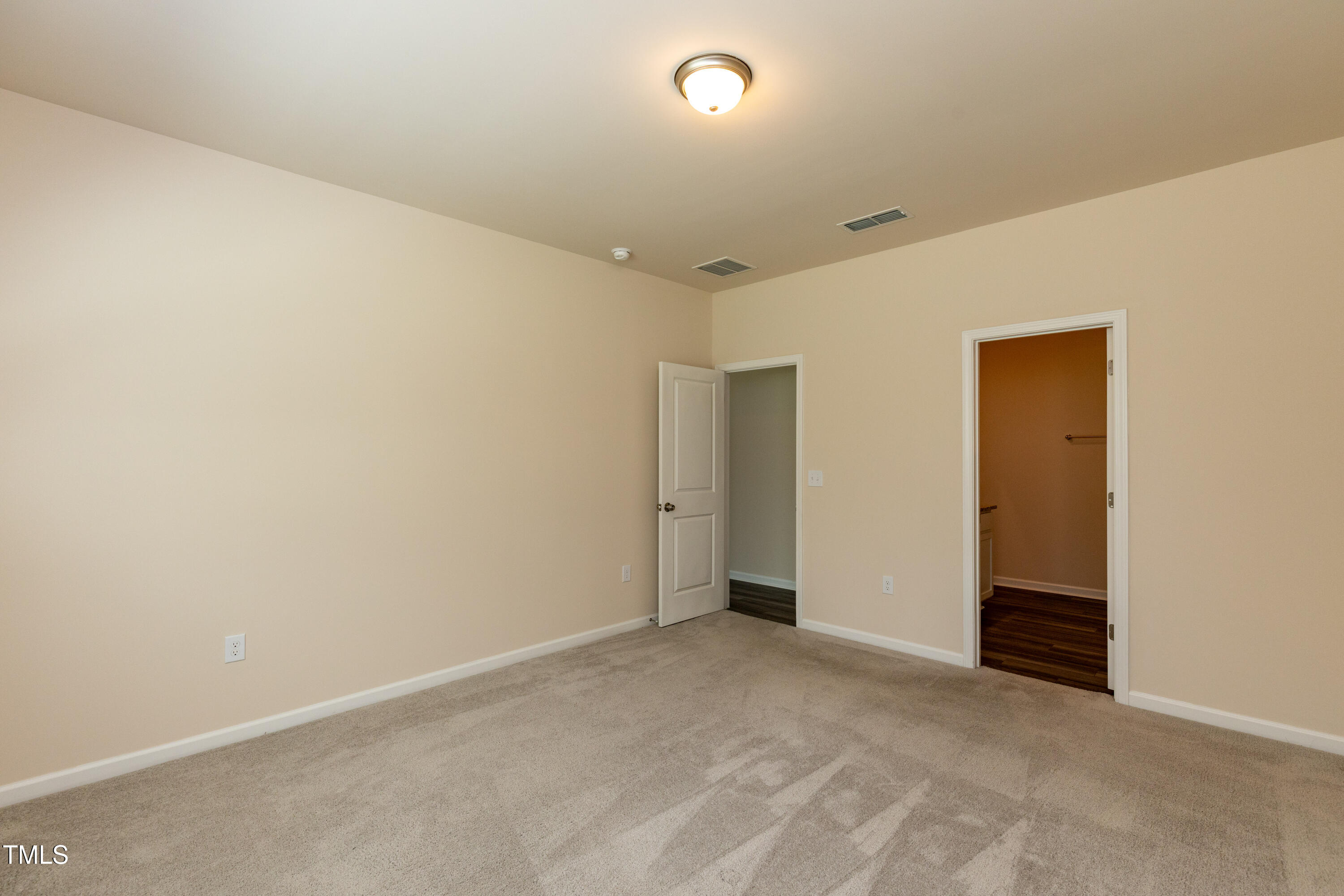 1444 Heron Pond Street Raleigh, NC 27604 - Photo 24 of 37 an empty room with an entryway