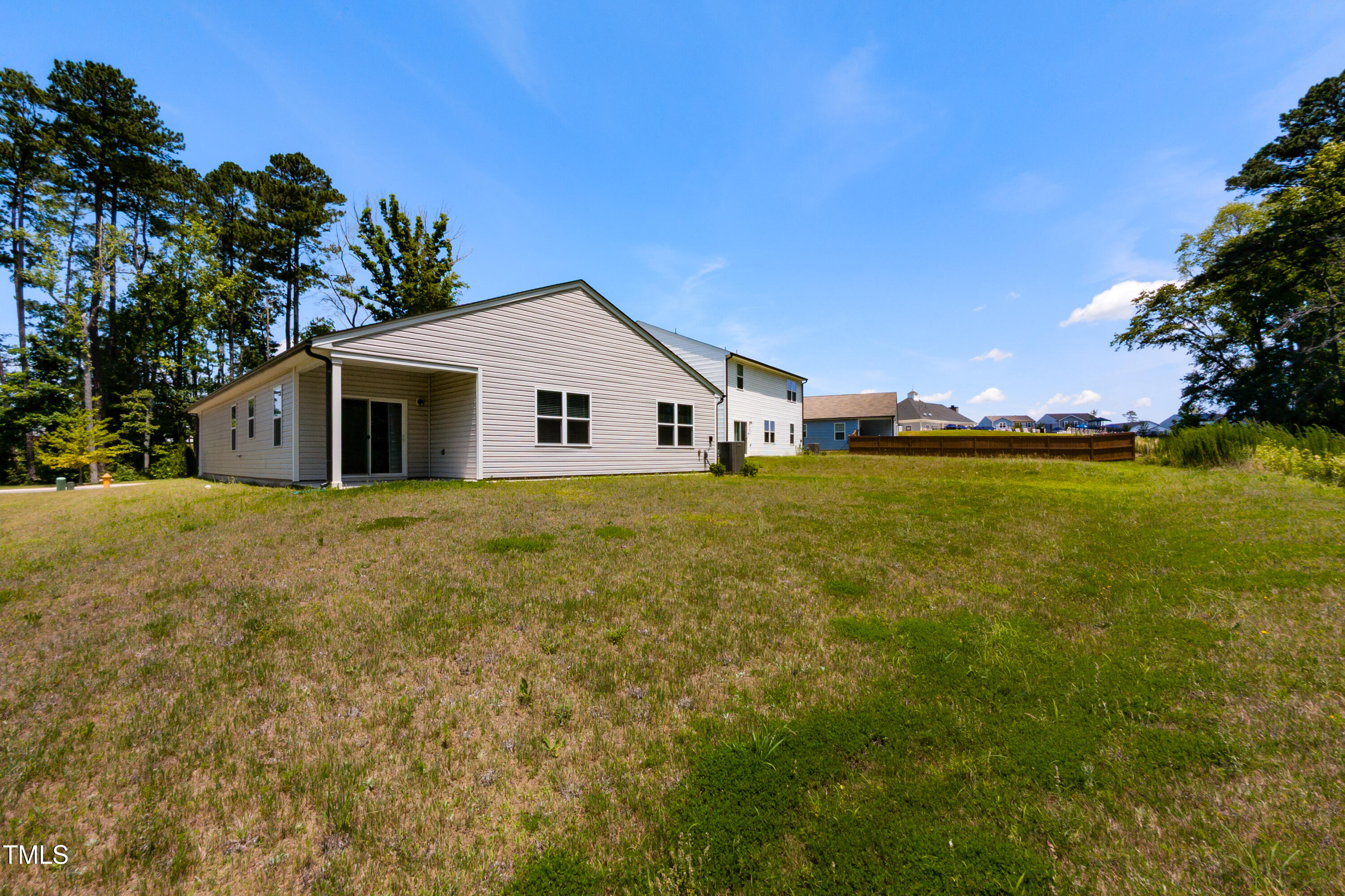 1444 Heron Pond Street Raleigh, NC 27604 - Photo 28 of 37 a view of a house with a yard