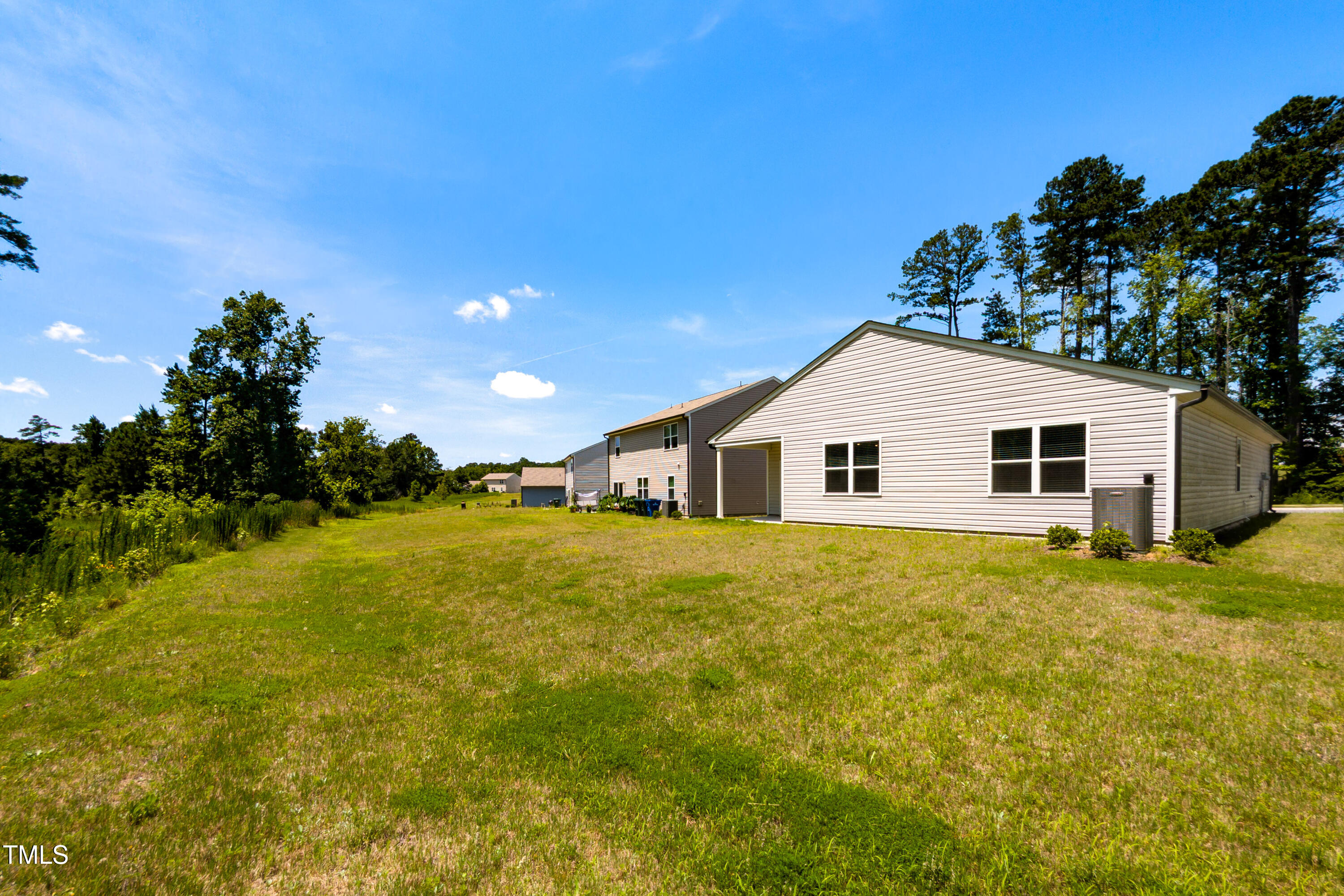 1444 Heron Pond Street Raleigh, NC 27604 - Photo 29 of 37 a view of a house with a yard