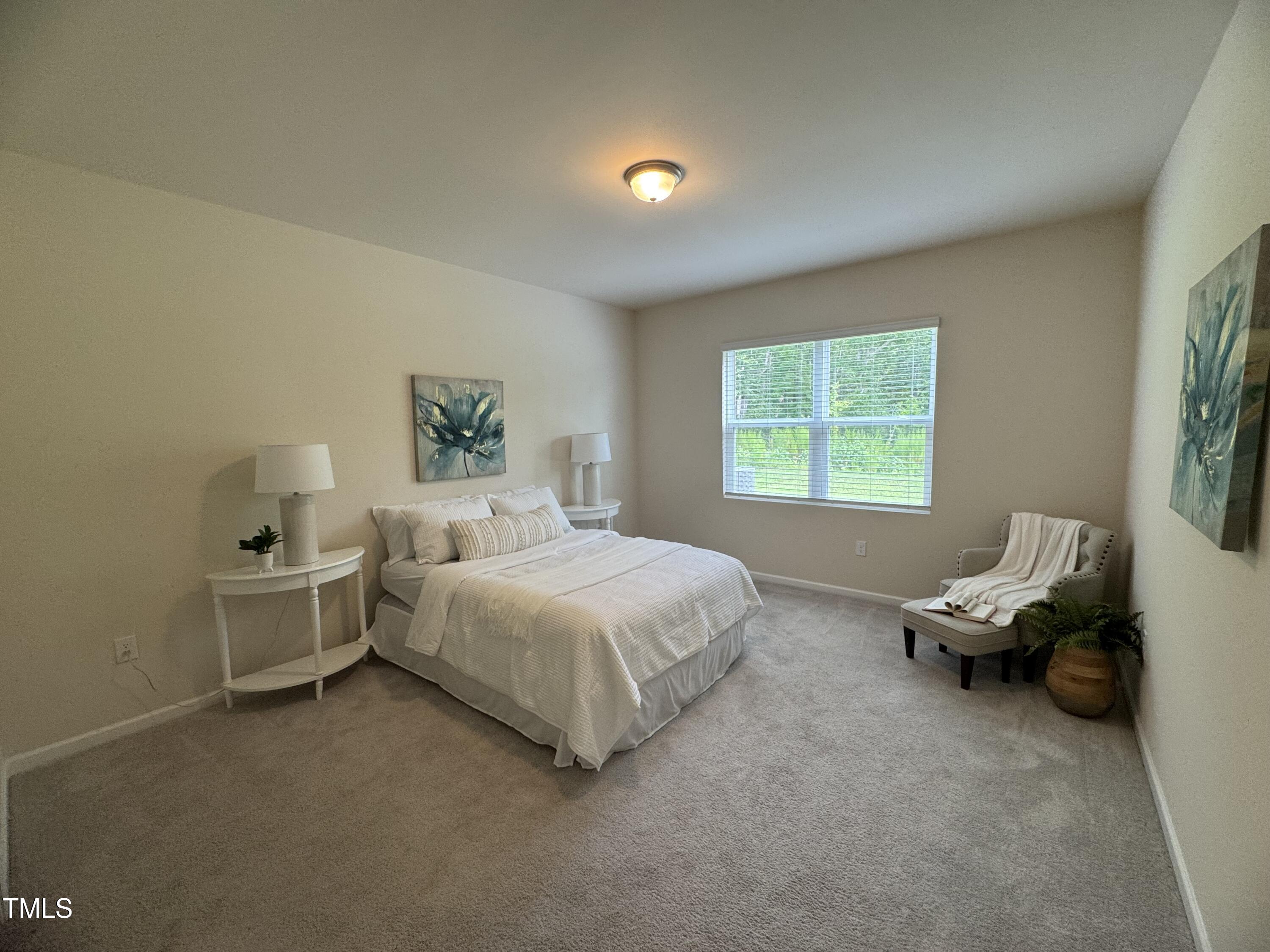 1444 Heron Pond Street Raleigh, NC 27604 - Photo 31 of 37 a bedroom with a bed and a window