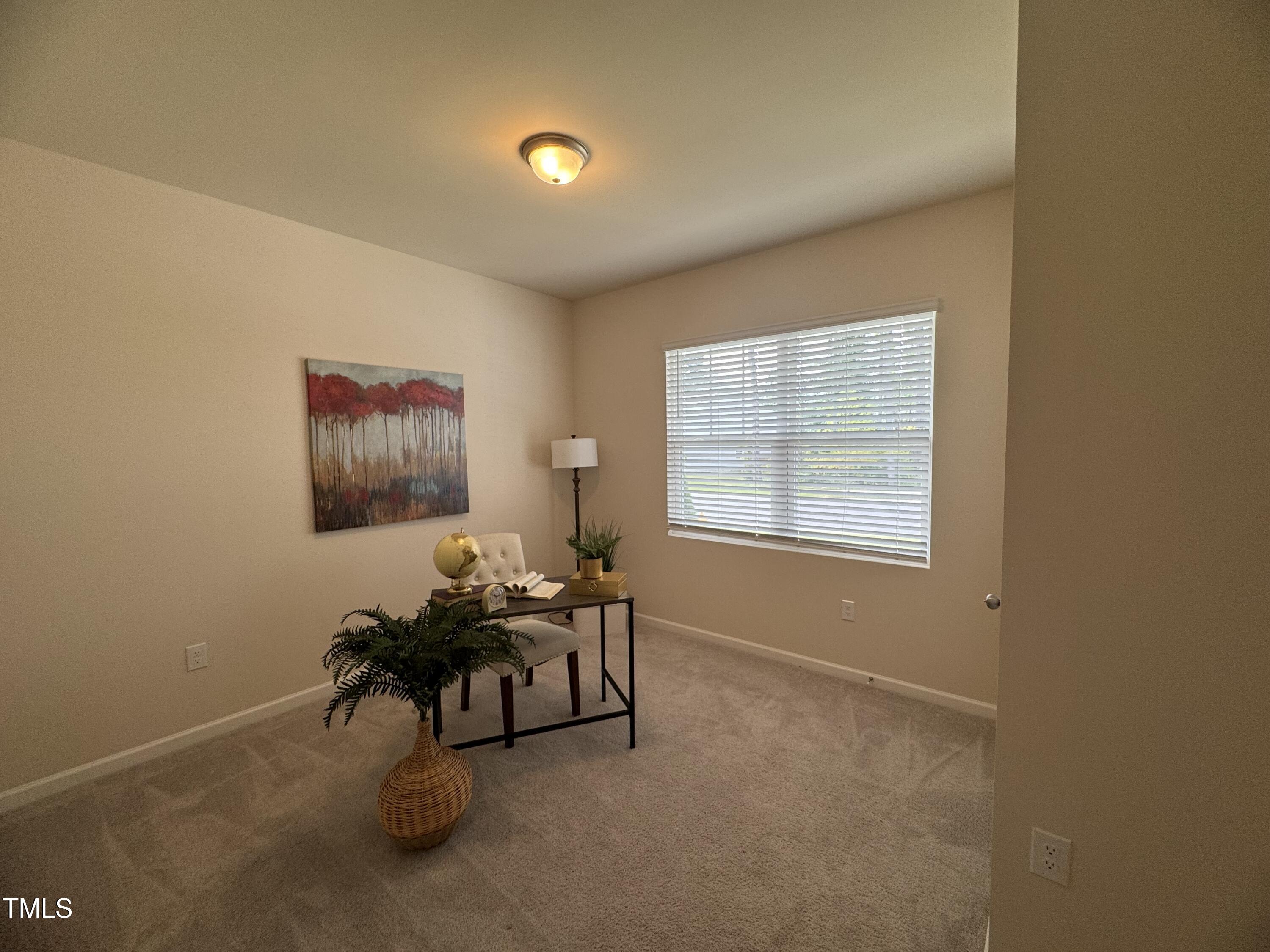 1444 Heron Pond Street Raleigh, NC 27604 - Photo 37 of 37 a living room with furniture and a window