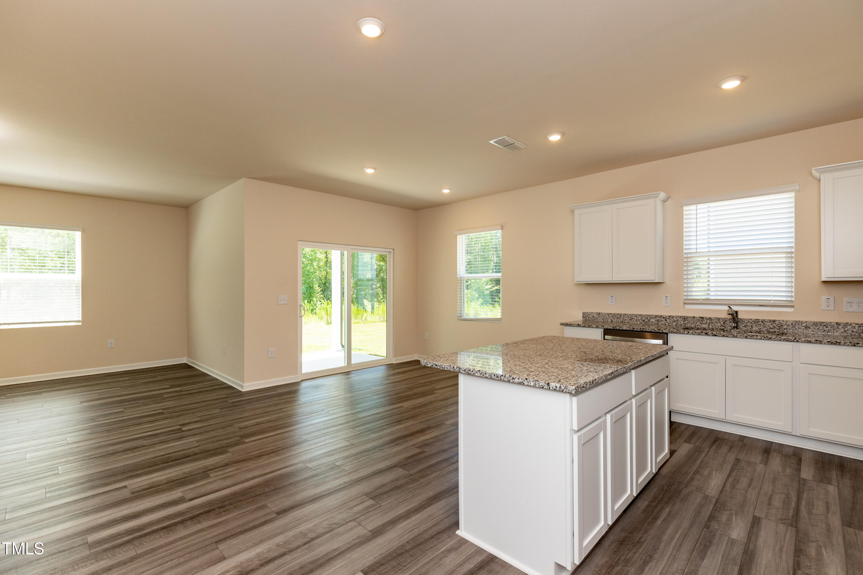 1444 Heron Pond Street Raleigh, NC 27604 - Photo 4 of 37 a kitchen with sink and wooden floor