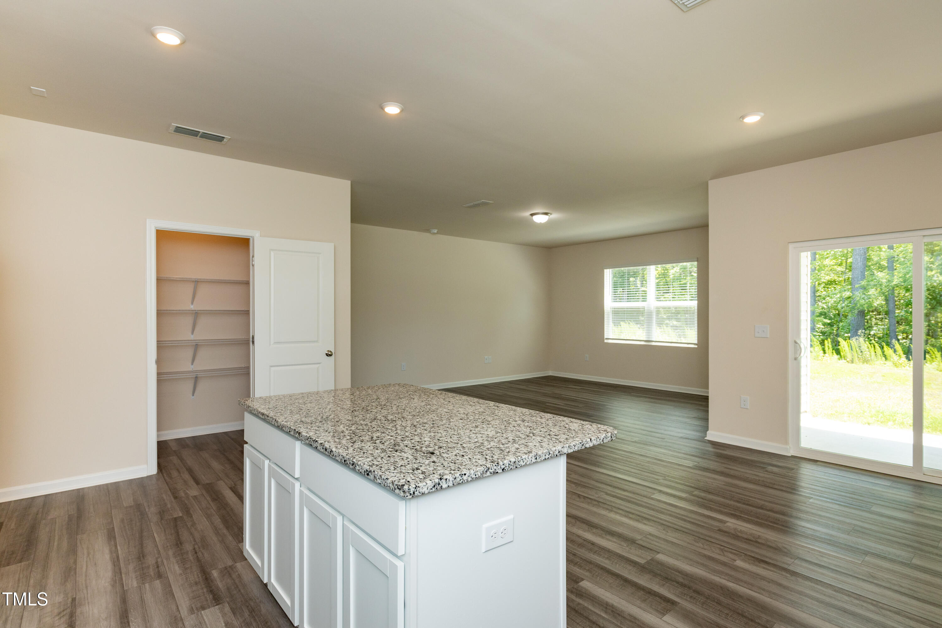 1444 Heron Pond Street Raleigh, NC 27604 - Photo 7 of 37 an empty room with wooden floor and window